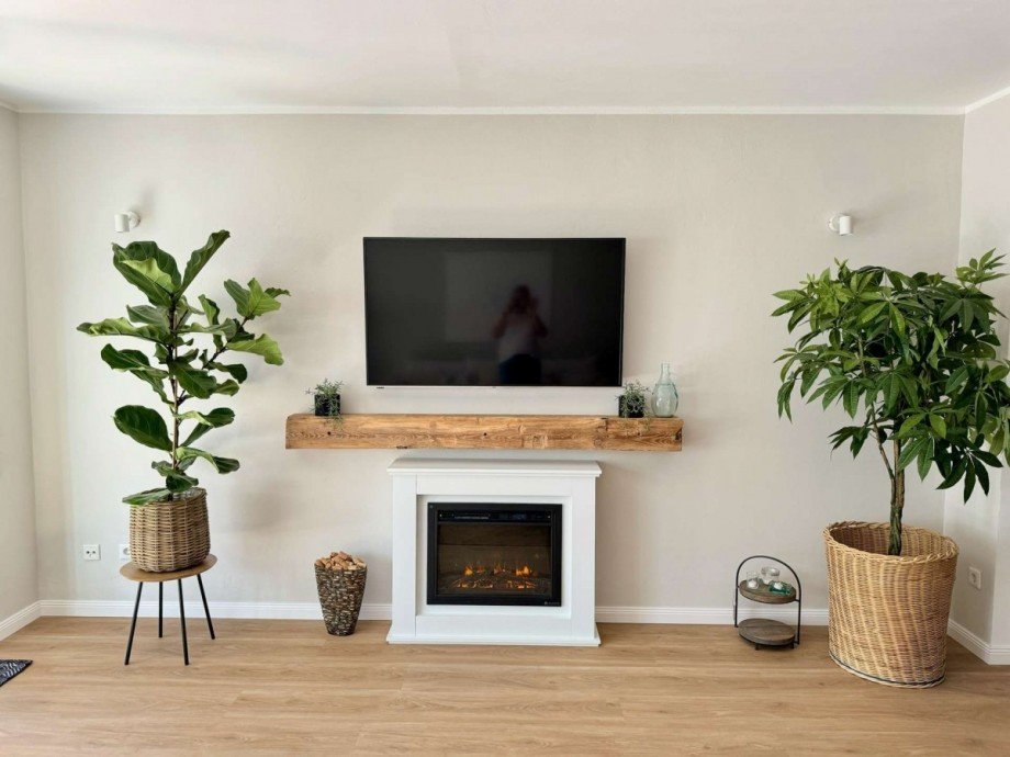 Wohnzimmer mit Elektrokamin Haus Bremen